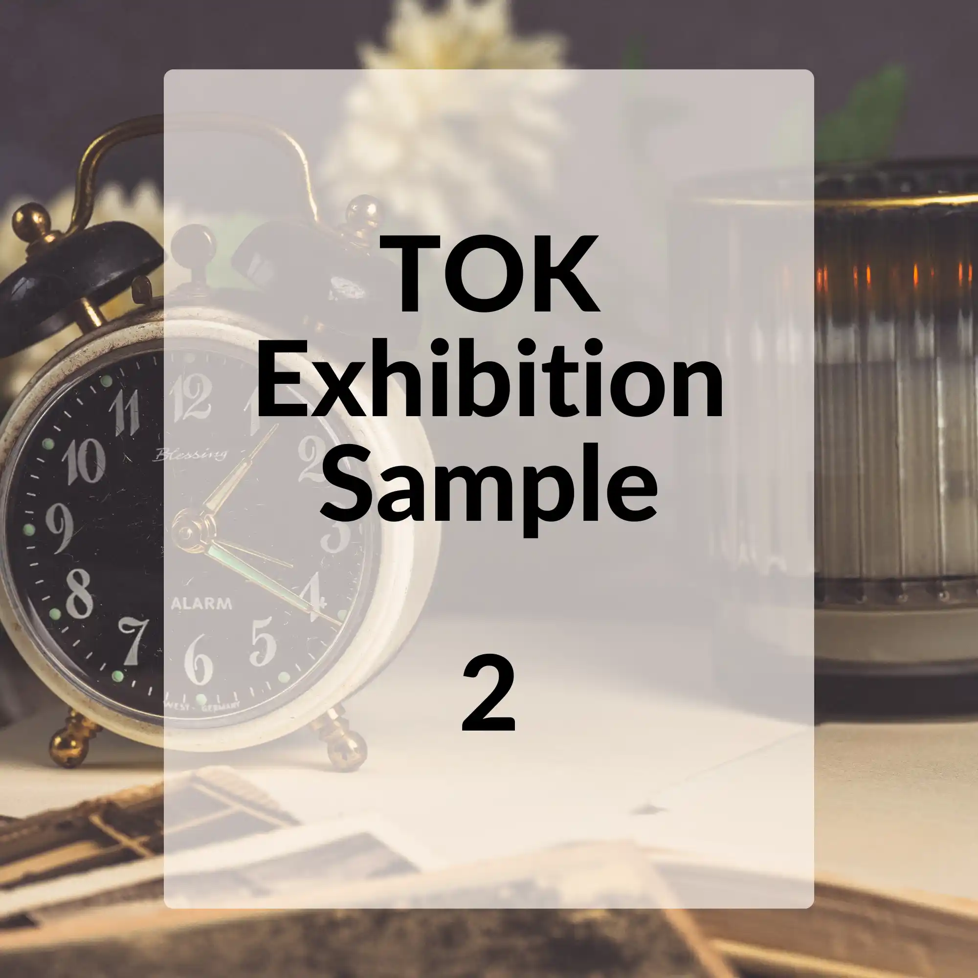 A square image with a blurred background featuring a vintage alarm clock, with a central white rectangle that reads "TOK Exhibition Sample 2" in black font and the number "2" prominently displayed at the bottom.