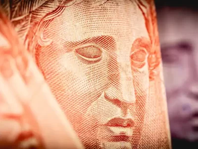 Close-up of a meticulously engraved portrait on a currency banknote, showcasing intricate line work and the artistry of currency design.